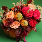 Floral composition in pumpkin with roses