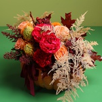 Floral composition in pumpkin with roses