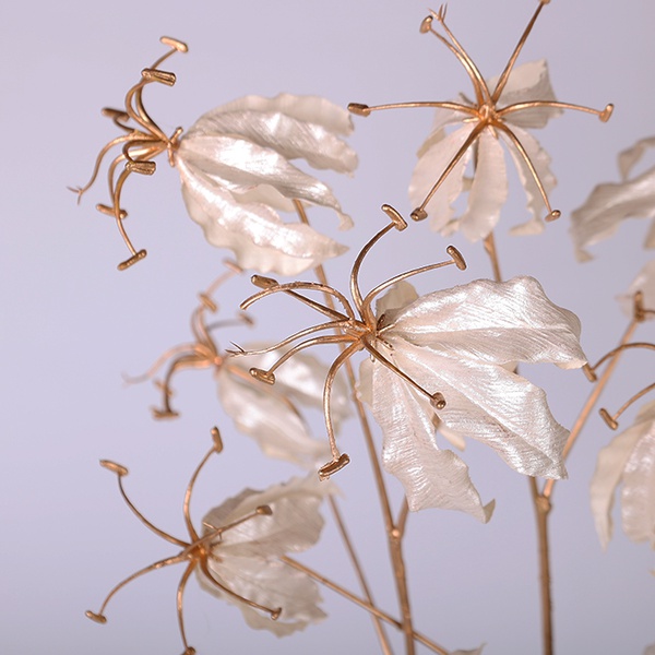 Decorative branch of white gloriosa