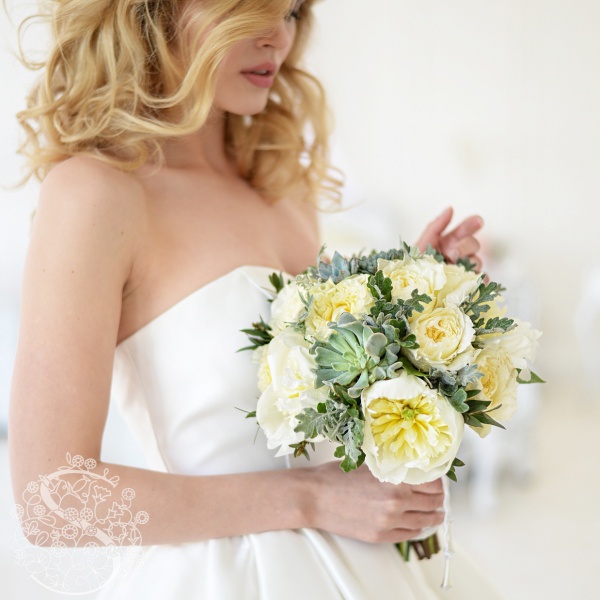 Wedding bouquet with white peonies