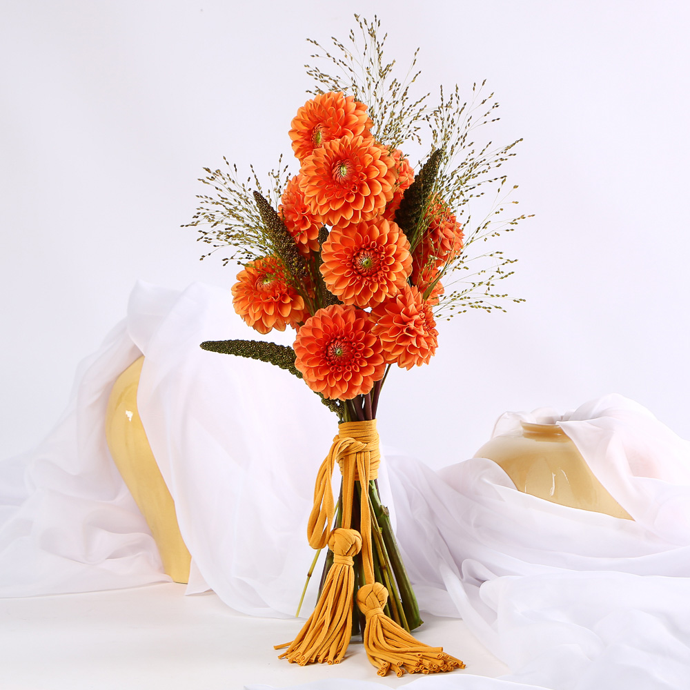 «Terracotta Bride» is a wedding bouquet of dahlias with tassels