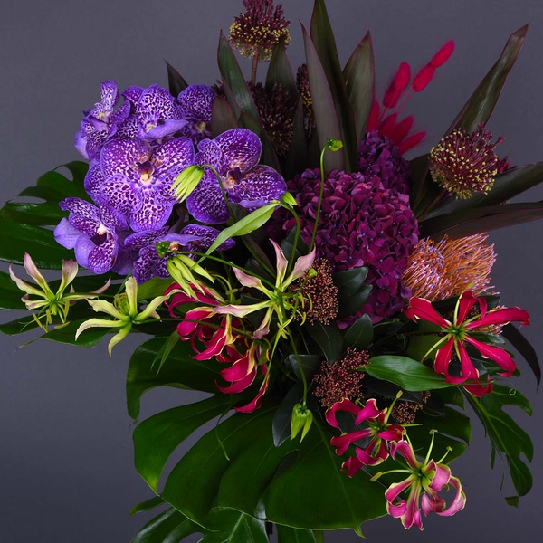 Flower bouquet with gloriosa and vanda