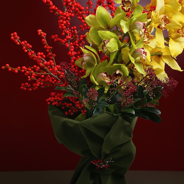 Bright bouquet with cymbidium and berries