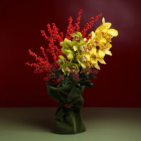 Bright bouquet with cymbidium and berries