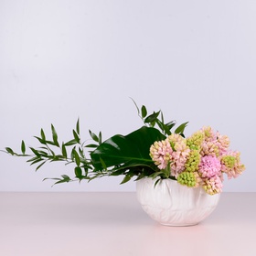 Hyacinths with greenery in a bowl