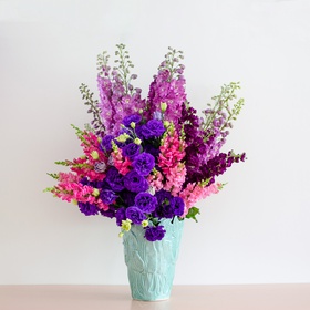 Bright bouquet in purple hues in a vase