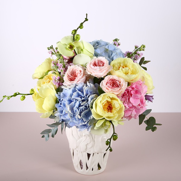 Bouquet with hydrangeas and yellow peonies in a vase