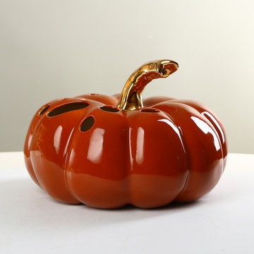 Ceramic pumpkin with holes Orange