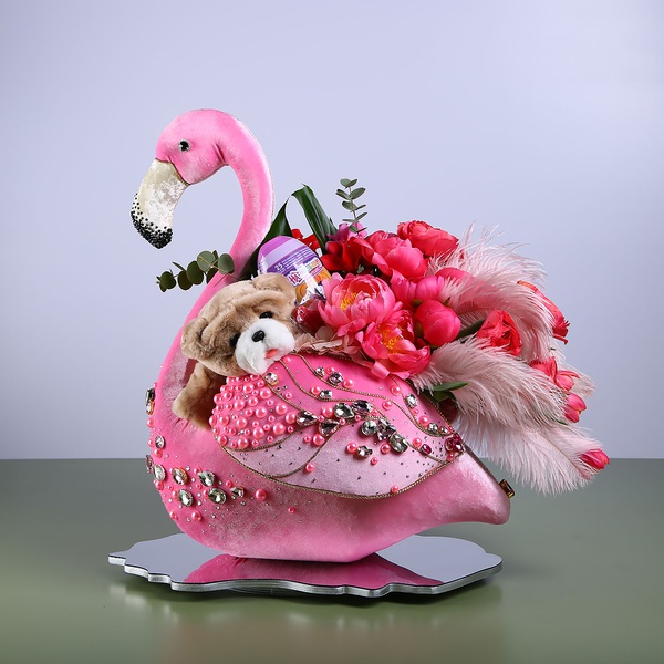 Floral composition in pink flamingo with peonies