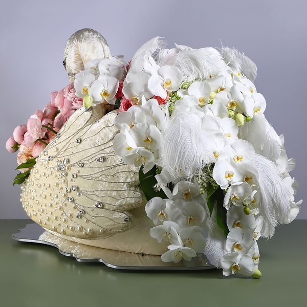 Floral compositioin in a swan with white phalaenopsis
