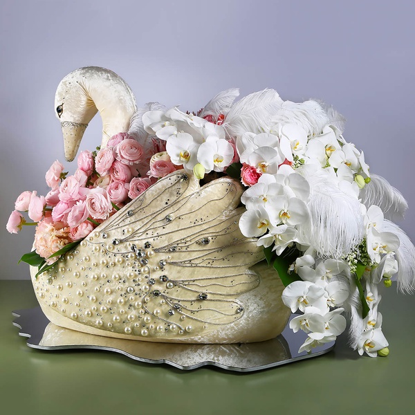 Floral compositioin in a swan with white phalaenopsis