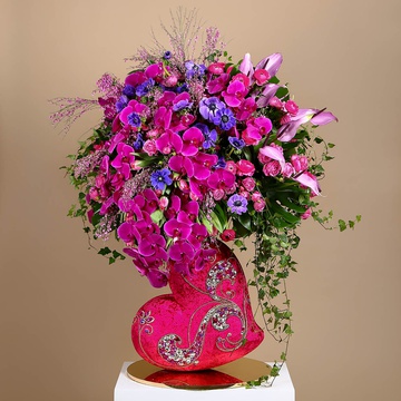 Flower composition in a heart vase