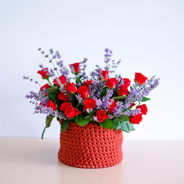 Composition of red roses with lavender