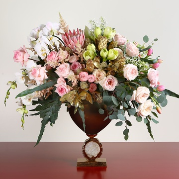 Floral interior composition in pink tones with Protea