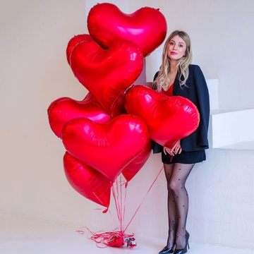 An armful of red heart balloons M