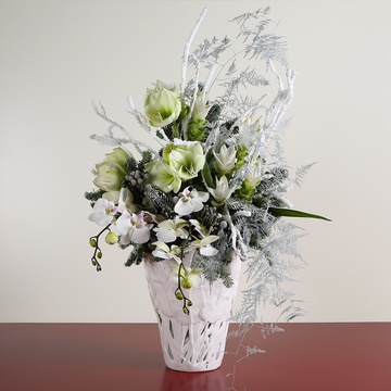 Interior bouquet with white amaryllis in a vase