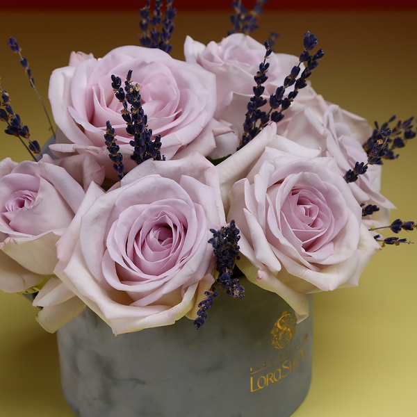 Composition of delicate roses and lavender