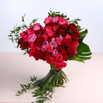Bouquet of bright roses in the shape of a heart