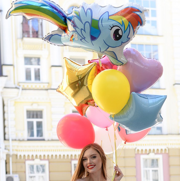 An armful of balloons with ponies