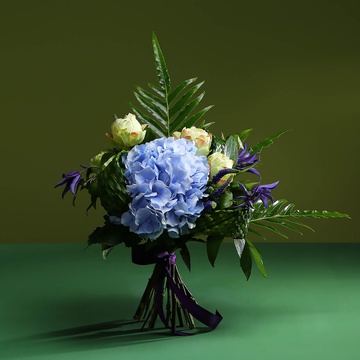 Bouquet of hydrangea and green weaving