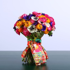 Bright bouquet of ranunculus and anemones