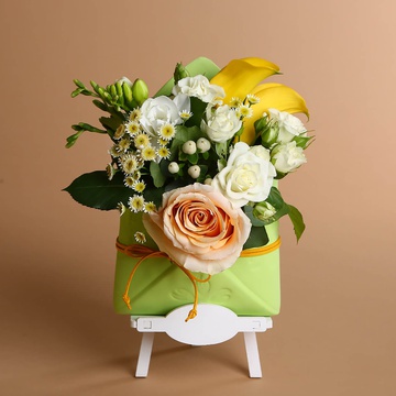 Floral composition with yellow accents in an envelope