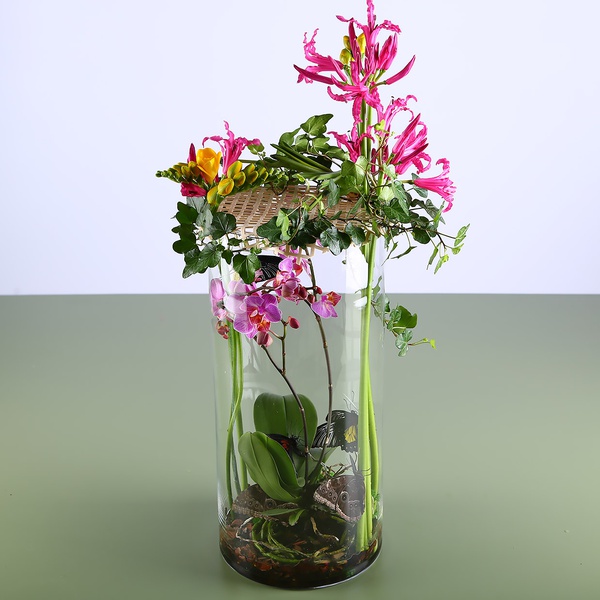 Floral composition in a vase with butterflies