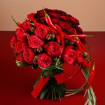 Heart shaped bouquet of roses and peppers