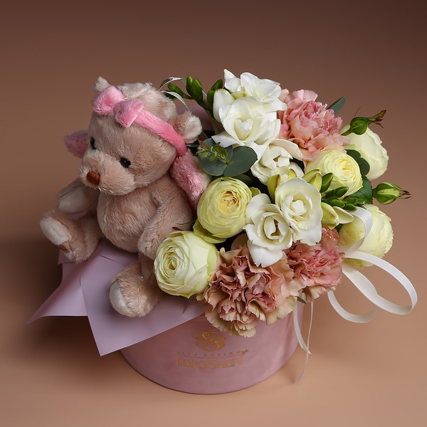 Floral composition with teddy bear