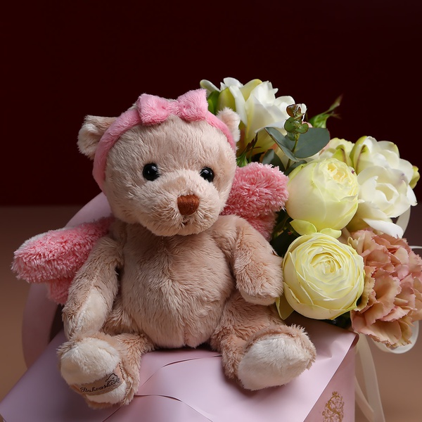 Floral composition with teddy bear