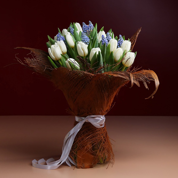 Bouquet of 35 white tulips in coconut bark