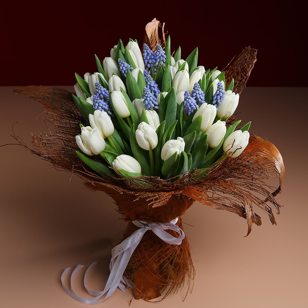 Bouquet of 35 white tulips in coconut bark