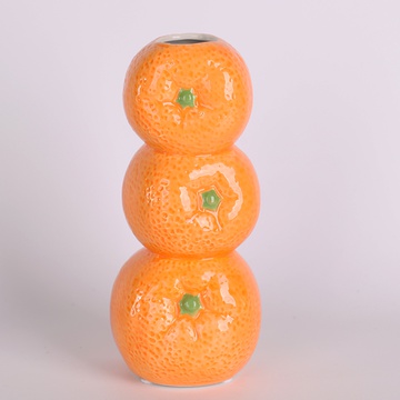 A vase of tangerines