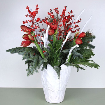 Interior bouquet with red amaryllis in a vase
