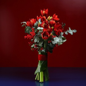 Bouquet of red amaryllis and ilex
