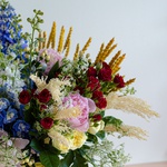 Ethno bouquet with dilphinium and roses