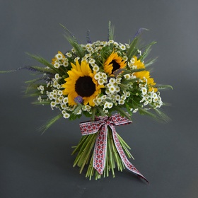Ethnic bouquet with sunflowers and tanacetum