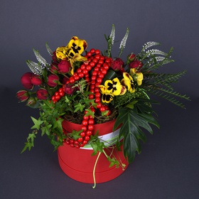 Ethno composition with beads in a red box