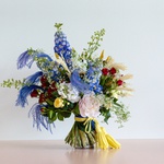 Ethno bouquet with dilphinium and roses