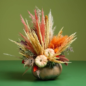 Floral composition in pumpkin with dried flowers