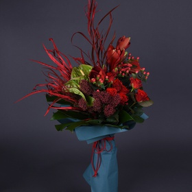 Bouquet with red flowers and greens