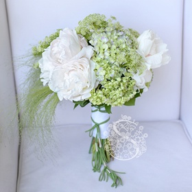 Wedding bouquet with pale pink peonies and hydrangea