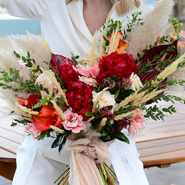 Wedding bouquet with peonies and dried flowers