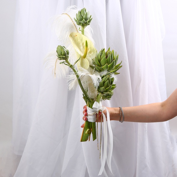 «Art Bride» is a wedding bouquet of anthuriums and artichokes with feathers