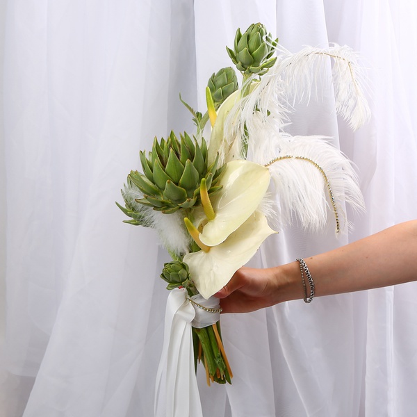 «Art Bride» is a wedding bouquet of anthuriums and artichokes with feathers