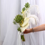 «Art Bride» is a wedding bouquet of anthuriums and artichokes with feathers